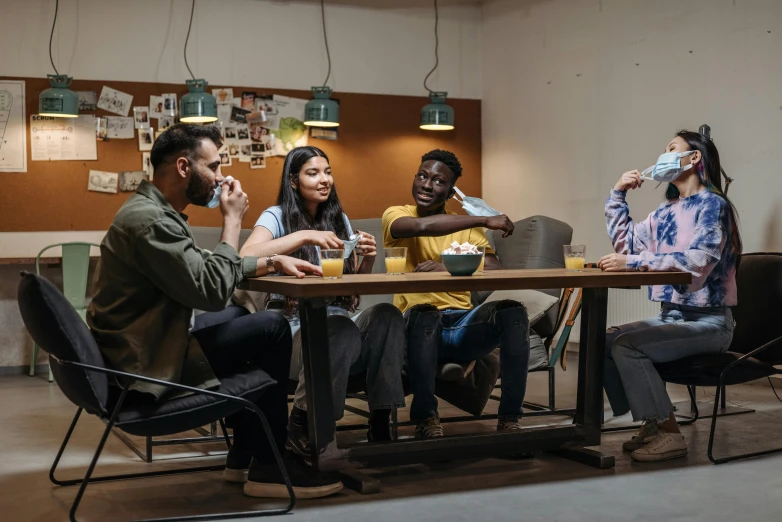 a group of people sitting around a wooden table, pexels contest winner, promotional photo, diverse, indoor scene, ad image