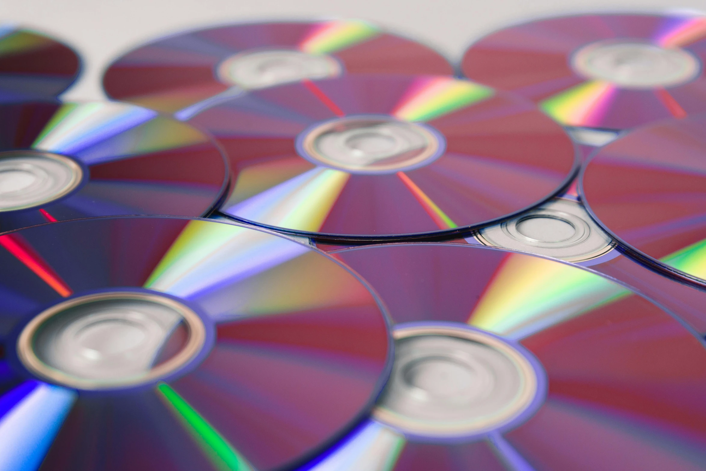 a pile of cds sitting on top of each other, pexels, computer art, hyper photorealistic raytracing, 3do magazine, blue rays from tv, ilustration