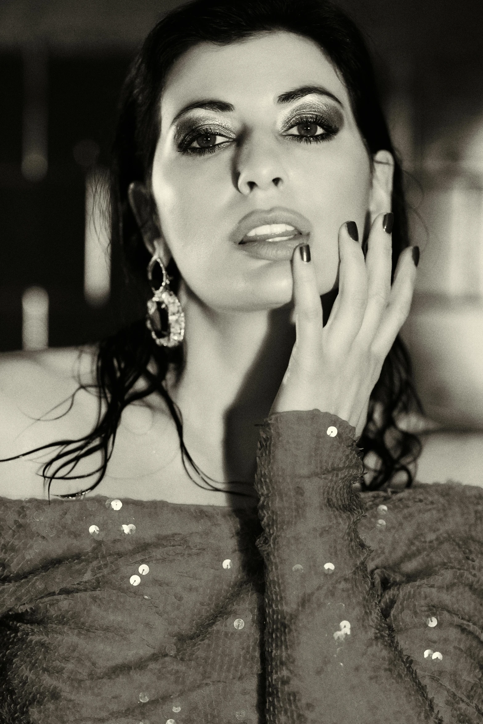 a black and white photo of a woman brushing her teeth, a black and white photo, inspired by George Hurrell, pexels, arabesque, sunny leone, wet look, woman with black hair, sepia