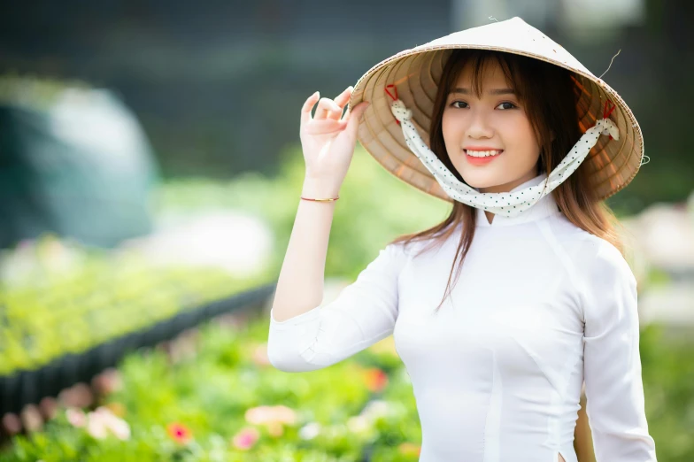 a woman in a hat is posing for a picture, inspired by Tan Ting-pho, background image, avatar image, cute girls, vietnam