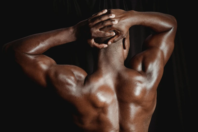 a man that is standing up with his back to the camera, inspired by Robert Mapplethorpe, pexels contest winner, mannerism, dark brown skin, fleshy musculature, 30 year old man :: athletic, portrait of head and body