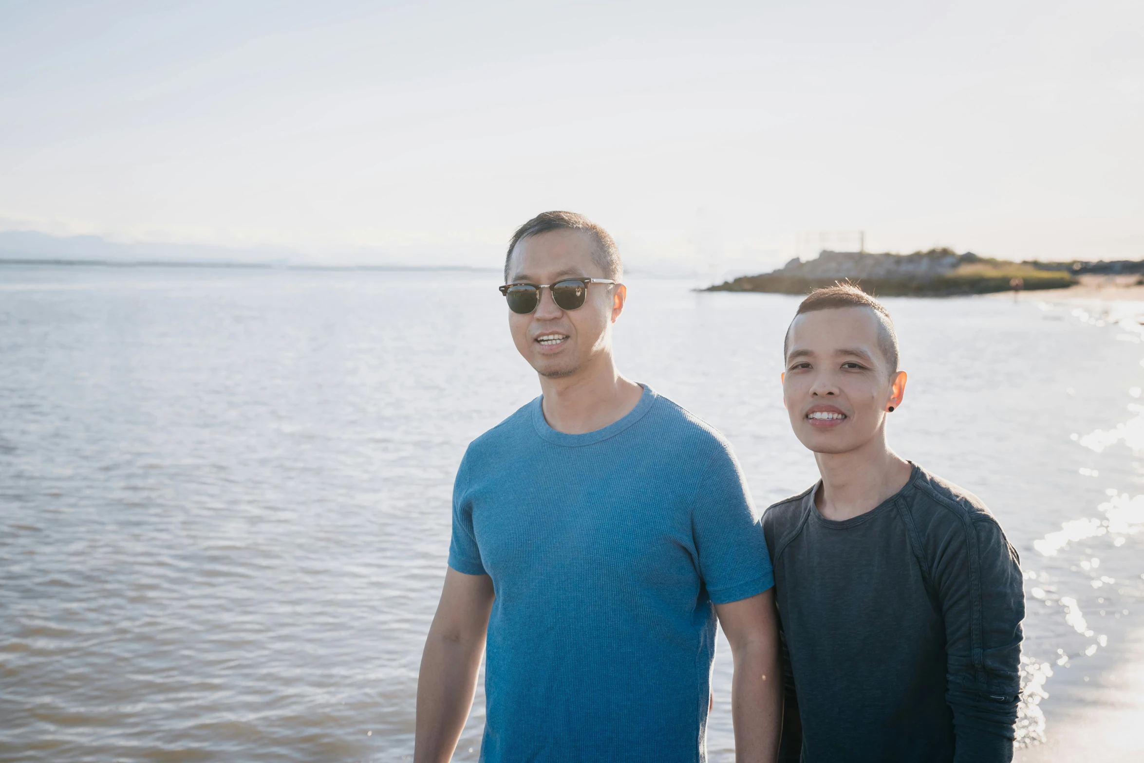 two men standing next to each other on a beach, lee griggs and jason chan, avatar image, seattle, profile image