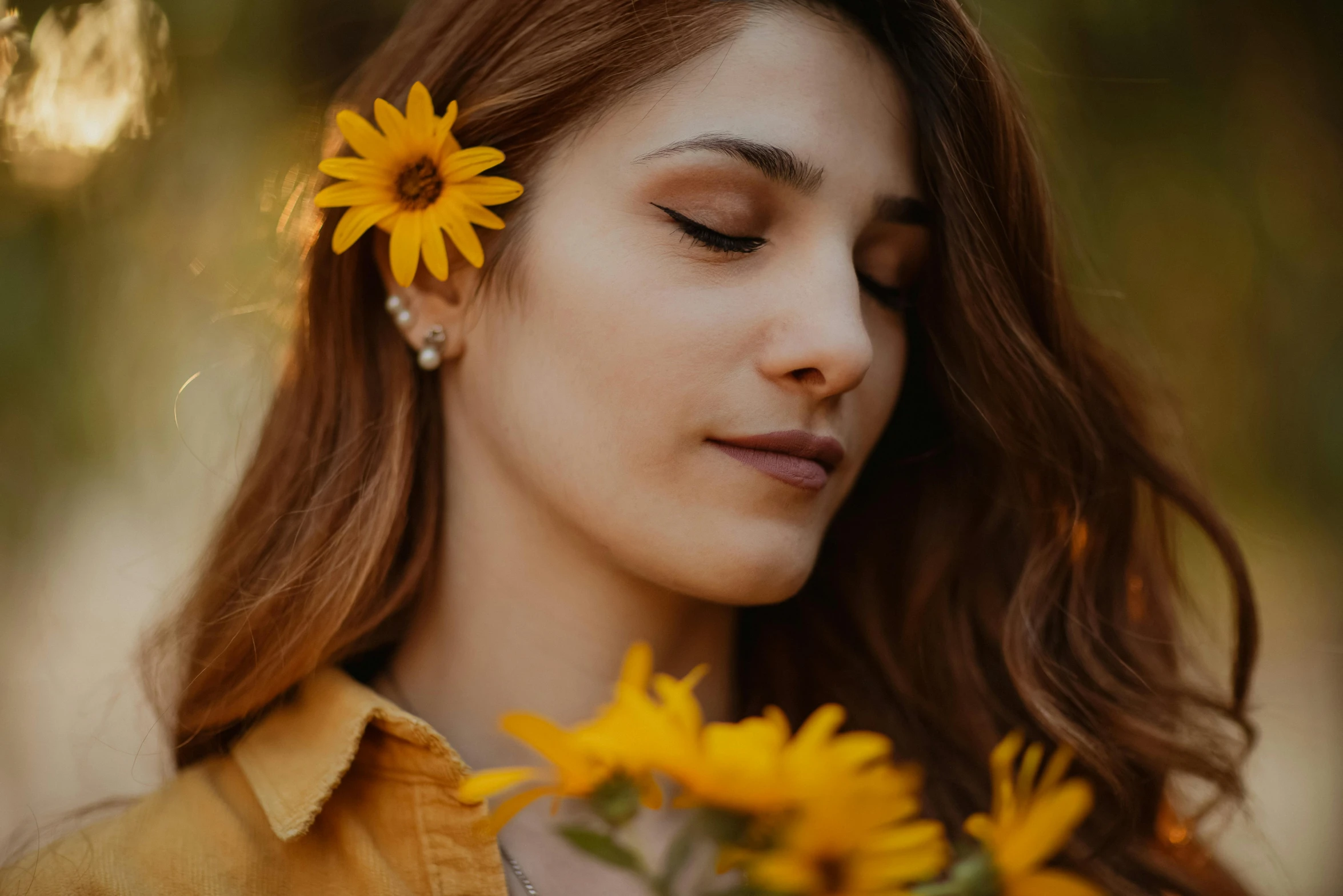 a woman with a flower in her hair, a picture, trending on pexels, yellow theme, brown haired, close-up photo, good lighted photo