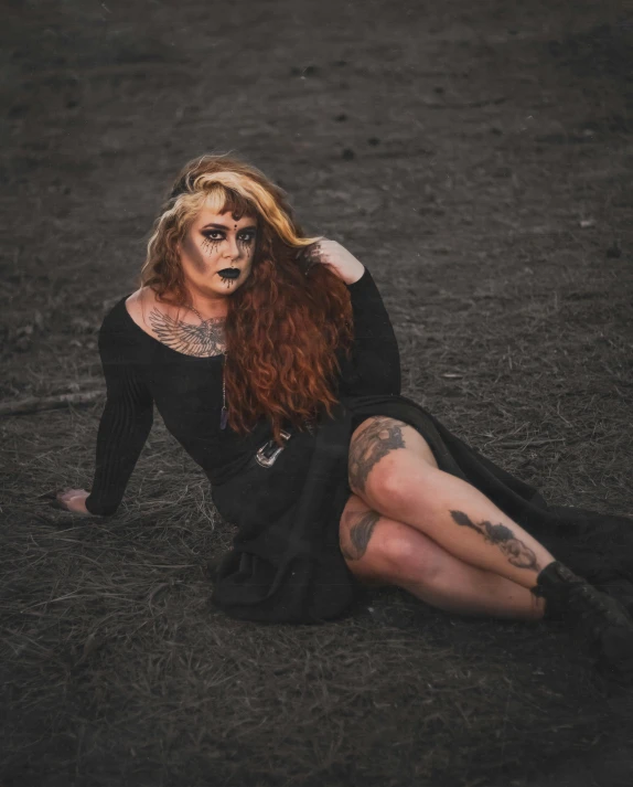 a woman with red hair sitting on the ground, inspired by Elsa Bleda, pexels contest winner, gothic art, drag, grunged up, vvitch, covered in dirt