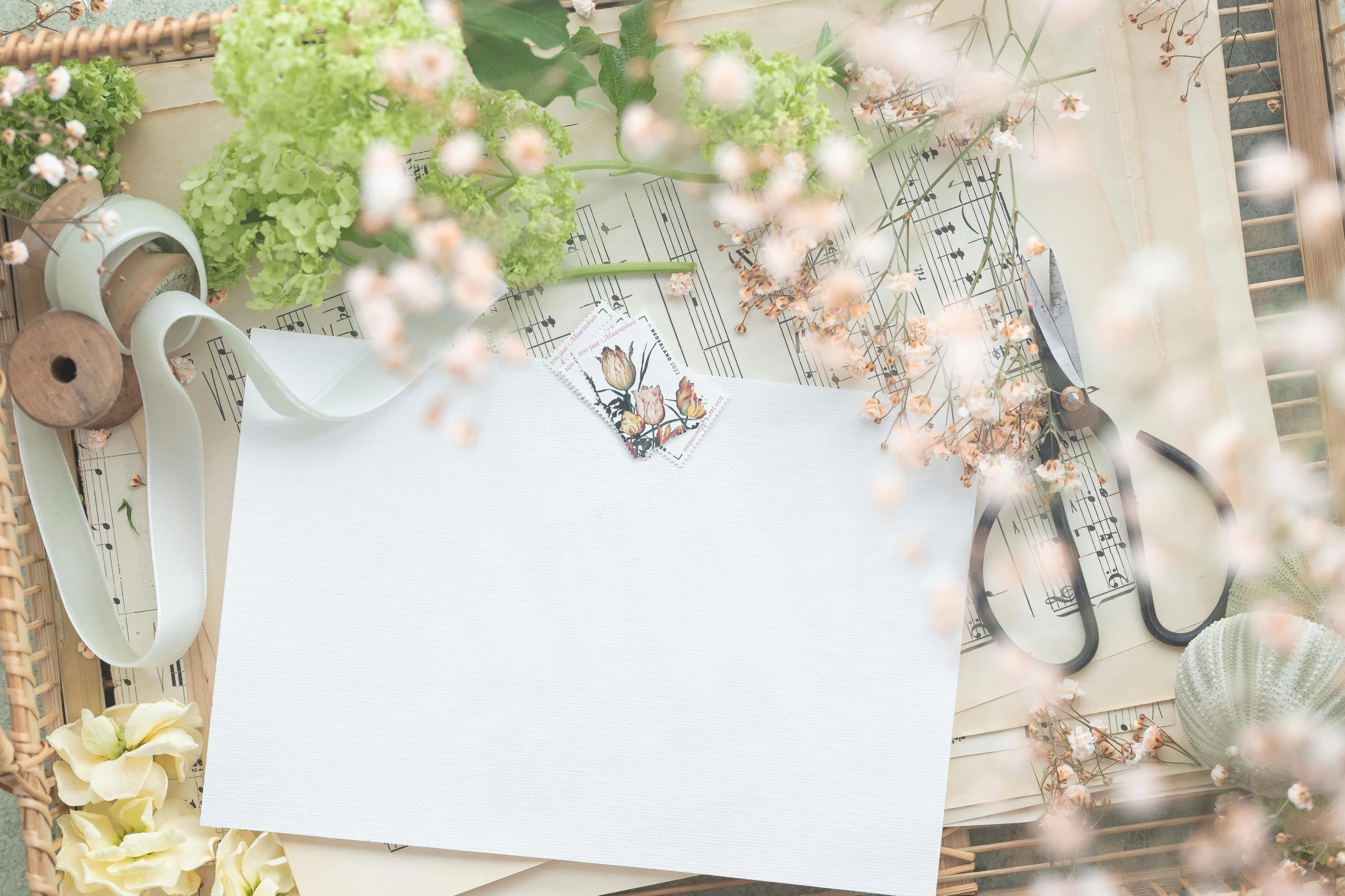 a bunch of papers sitting on top of a table, by Carey Morris, pexels contest winner, mail art, flowers and blossoms, white space, background image