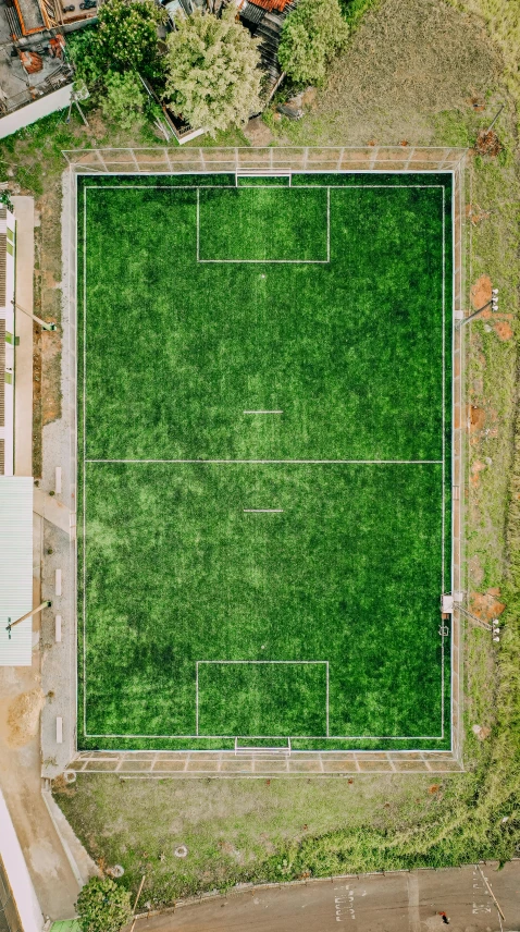 an aerial view of a green soccer field, by Attila Meszlenyi, high res 8k, building cover with plant, 15081959 21121991 01012000 4k, instagram story