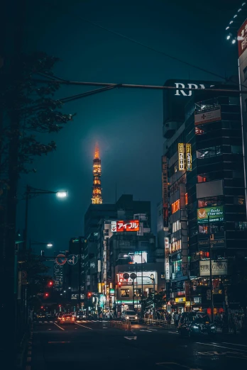 a city street filled with lots of traffic at night, inspired by Kanō Hōgai, unsplash contest winner, tall metal towers, ethnicity : japanese, skyline showing, streetlight at night