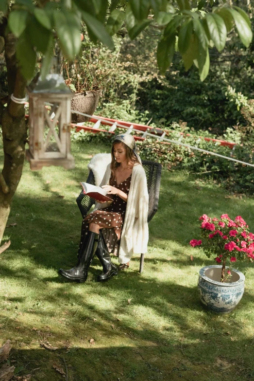 a woman sitting on a bench reading a book, in a garden, cosy vibes, kneehigh boots, sitting on chair