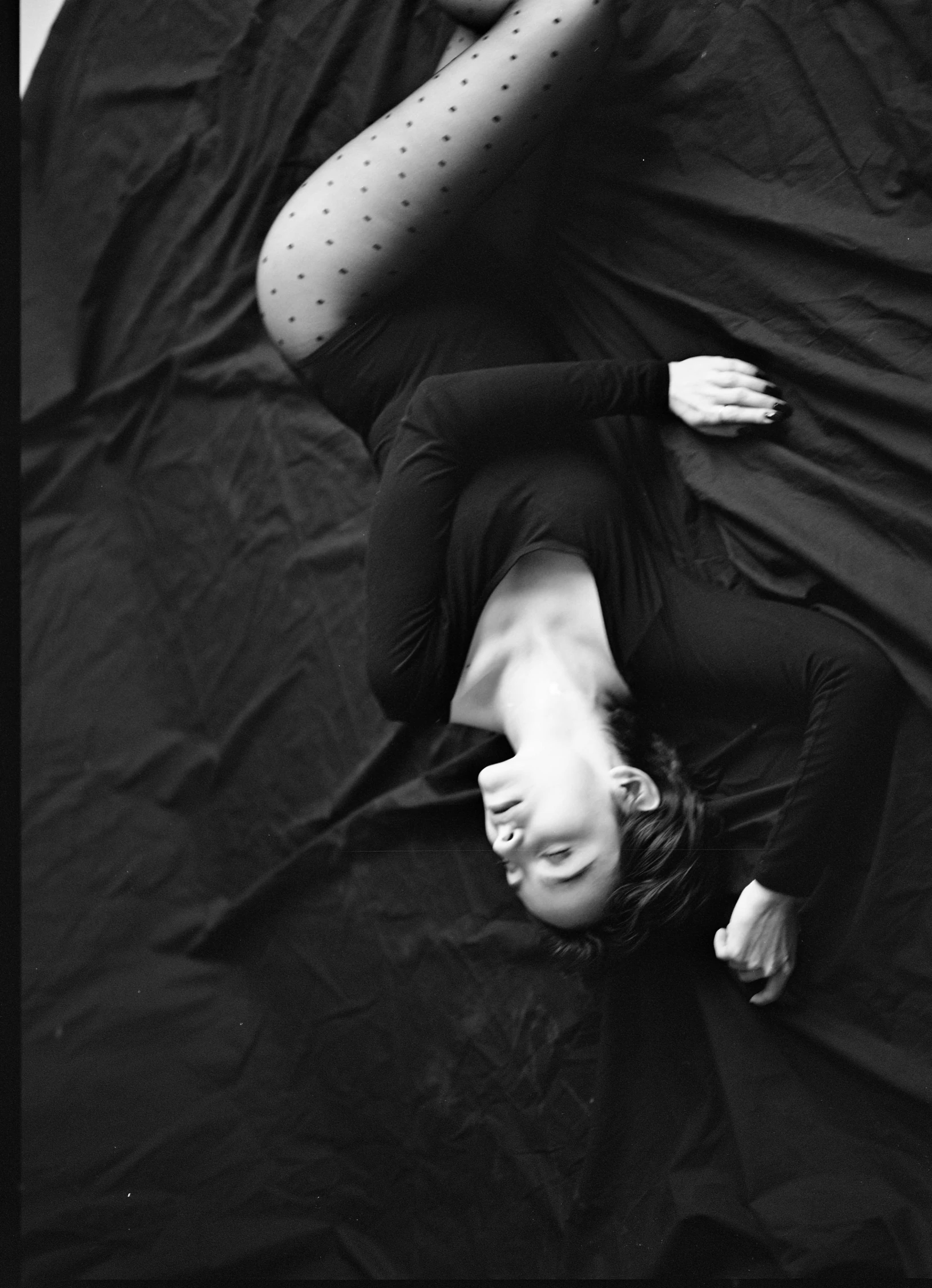 a black and white photo of a woman laying on a bed, a black and white photo, unsplash, conceptual art, studio medium format photograph, black cloth, 15081959 21121991 01012000 4k, medium format