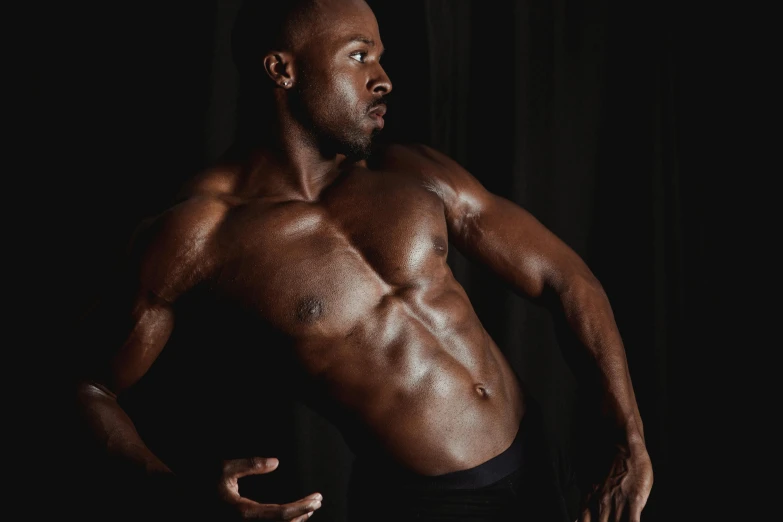 a shirtless man standing in front of a black background, by Sam Charles, pexels contest winner, ebony skin, physical : tinyest midriff ever, 30 year old man :: athletic, two muscular men entwined