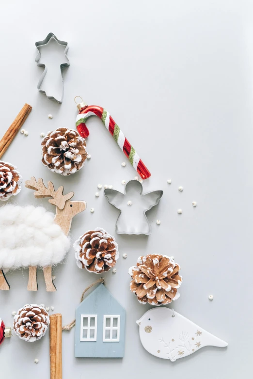 a christmas tree made out of pine cones and other decorations, a cartoon, trending on pexels, flatlay, cream and white color scheme, thumbnail, made of glazed