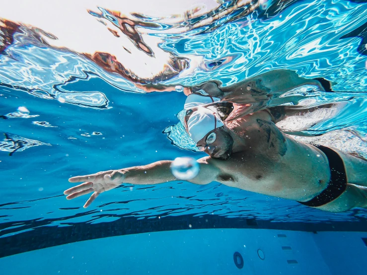 a man swimming under the surface of the water, profile image, aquatic devices, thumbnail, features