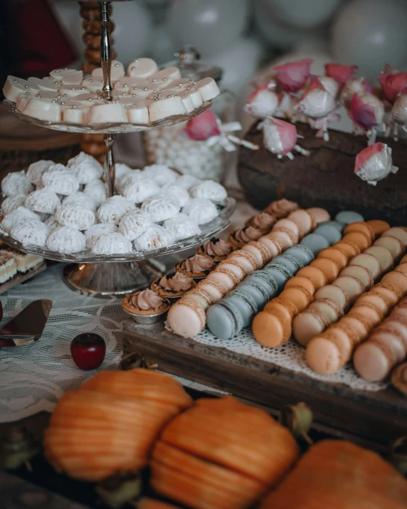 a table topped with lots of different types of pastries, by Emma Andijewska, unsplash, rococo, pumpkins, macaron, 15081959 21121991 01012000 4k