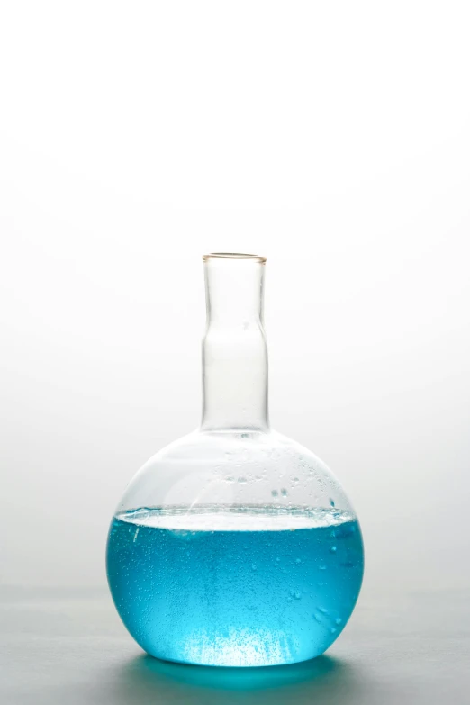 a bottle filled with blue liquid sitting on top of a table, by Doug Ohlson, clean white lab background, bubble chamber, teal, f / 1 6