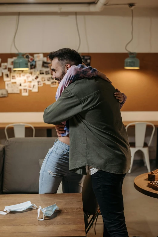 a couple of people that are standing in a room, pexels contest winner, happening, hugging and cradling, on a coffee table, commercial, leaving a room