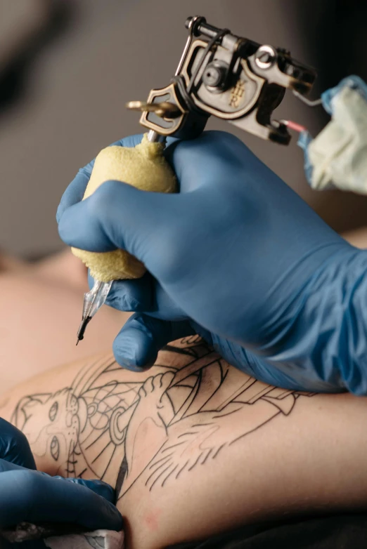 a man getting a tattoo on his arm, trending on pexels, process art, blue, square, ilustration, partially cupping her hands