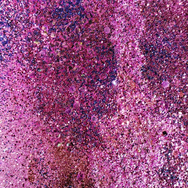 a red fire hydrant sitting on top of a lush green field, by Howardena Pindell, kinetic pointillism, pink violet light, macro up view metallic, full of sand and glitter, close-up from above