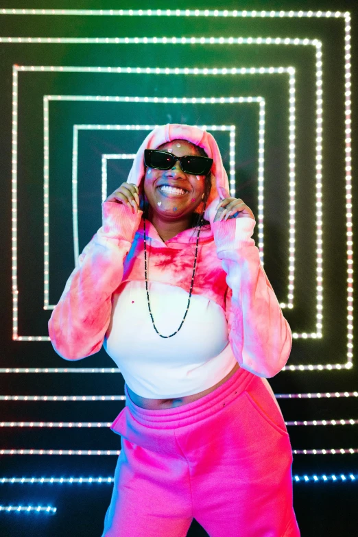 a woman standing in front of a neon sign, an album cover, pexels, funk art, wearing a pink rabbit costume, 2 5 6 x 2 5 6 pixels, grandma, 2 chainz