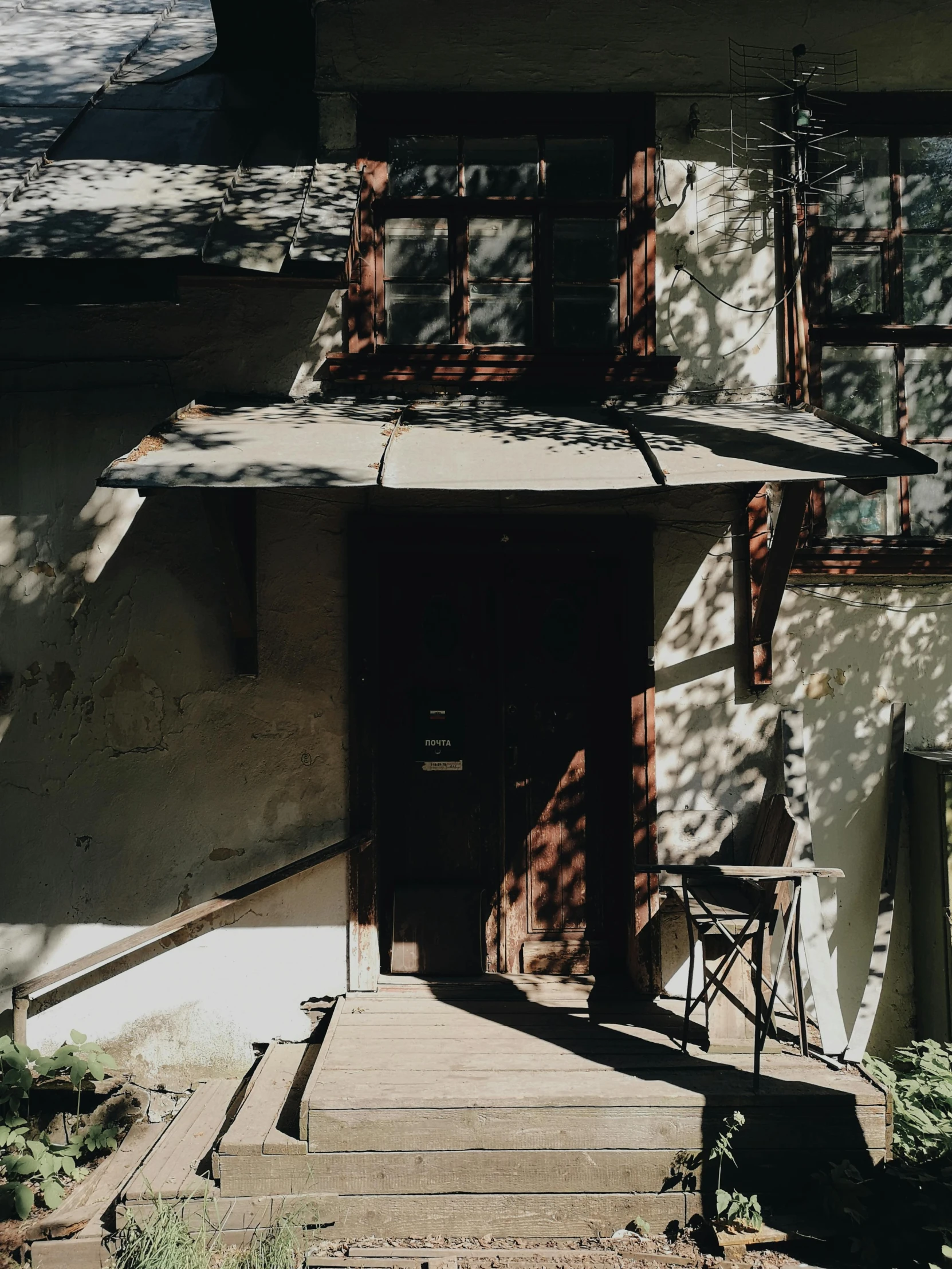 a white house with a brown door and brown shutters, inspired by Henryk Siemiradzki, unsplash, shin hanga, entrance to abandoned mine, shaded lighting, instagram picture, andrey tarkovsky