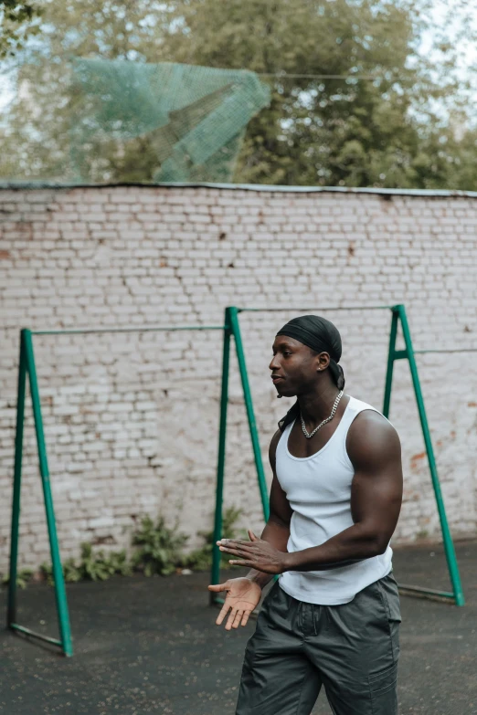 a man standing on a basketball court holding a basketball, by Attila Meszlenyi, pexels contest winner, handsome hip hop young black man, in the yard, russian, epk