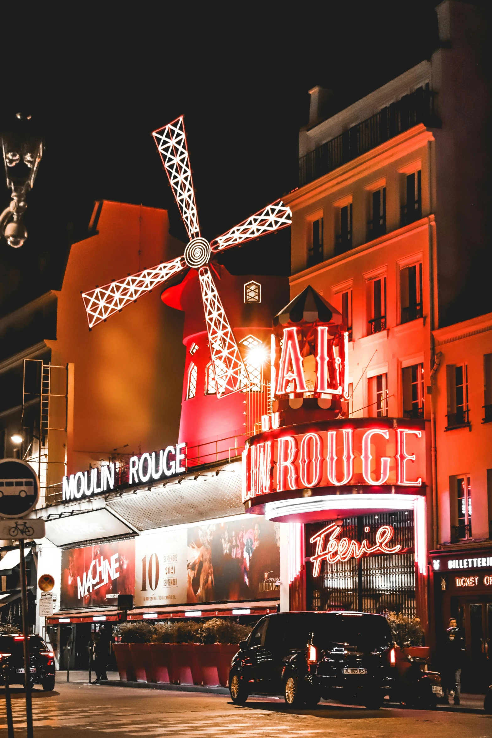 a windmill in the middle of a city at night, pexels contest winner, art nouveau, moulin rouge, warm street lights store front, red and white neon, square