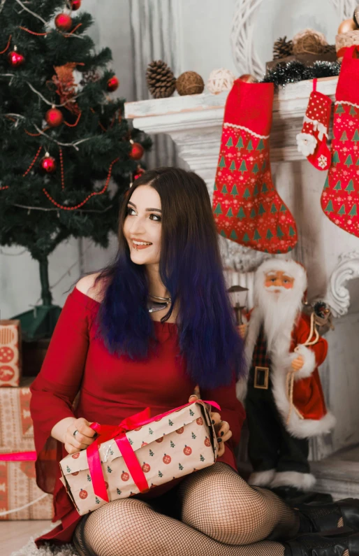 a woman sitting in front of a christmas tree with presents, a picture, by Julia Pishtar, long dark purple hair, russian girlfriend, profile picture 1024px, background image