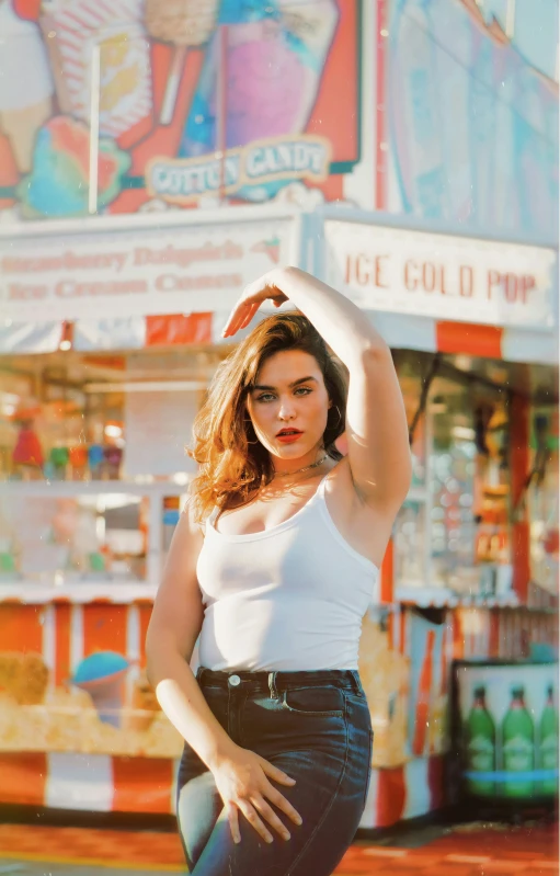 a woman posing for a picture in front of a carnival, an album cover, pexels, ana de armas, milk bar magazine, hot summer day, charli bowater