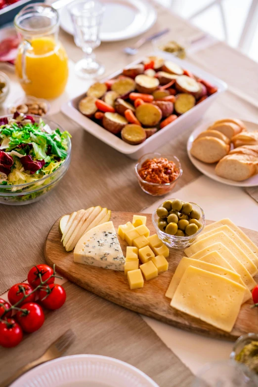 a wooden table topped with plates of food, (cheese), 6 pack, lifestyle