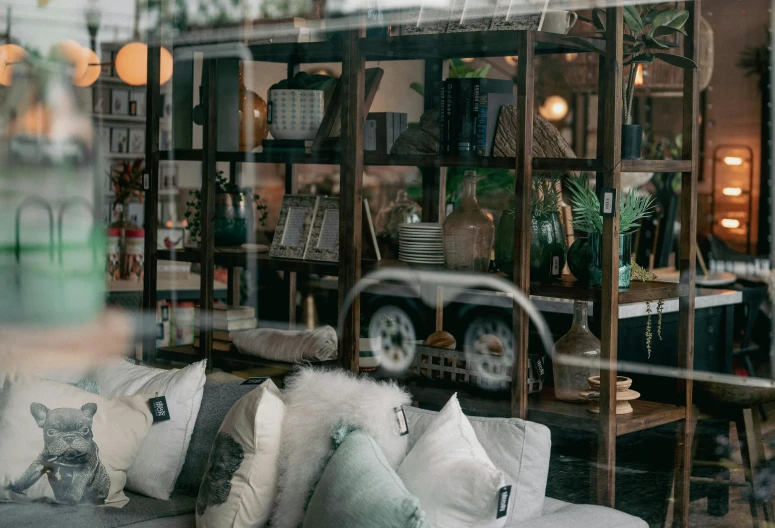 a couch that is sitting in front of a window, by Liza Donnelly, pexels contest winner, maximalism, sitting on a store shelf, inside in a glass box, in chippendale sydney, inspect in inventory image