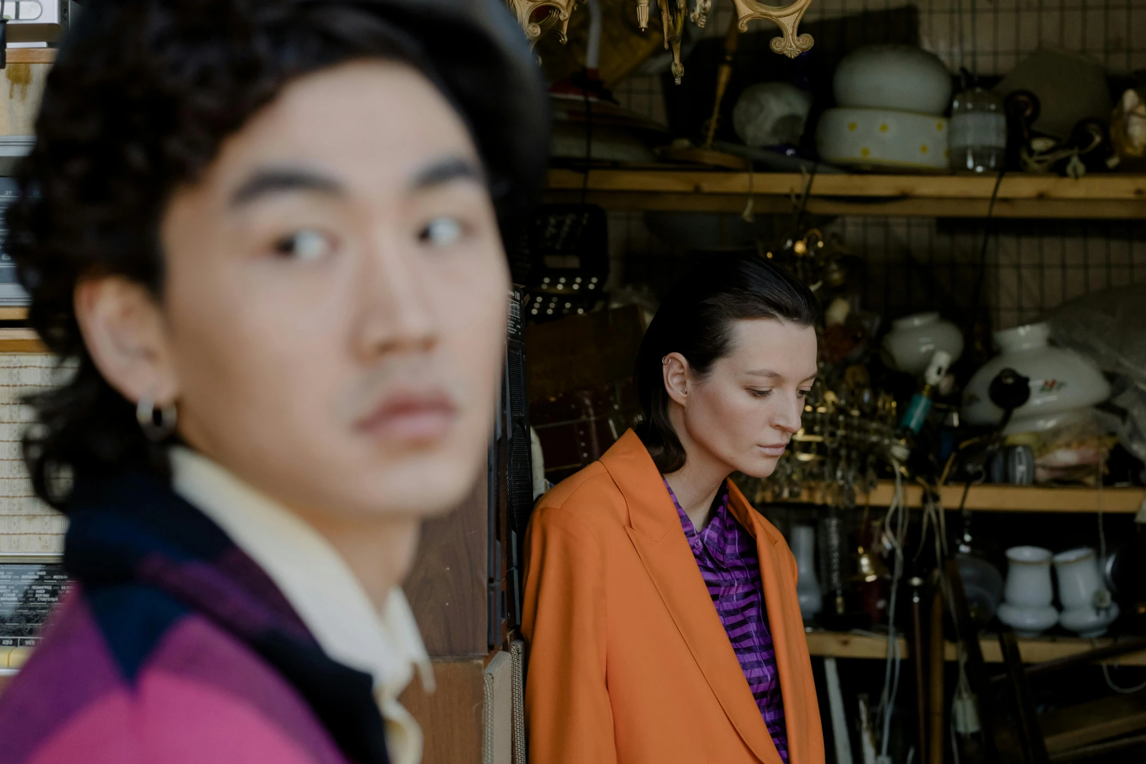 a man and a woman standing next to each other, a portrait, trending on pexels, shin hanga, dries van noten, behind the scenes photo, merchants, brightly coloured