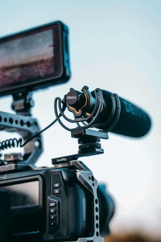 a close up of a camera on a tripod, by Dan Content, unsplash, video art, cinematic blue and gold, microphones, shot on sony a 7 iii, streaming on twitch