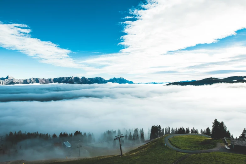 a view from the top of a mountain above the clouds, by Sebastian Spreng, pexels contest winner, chairlifts, avatar image