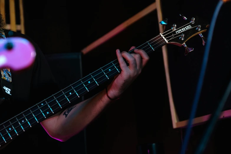 a close up of a person playing a guitar, profile image