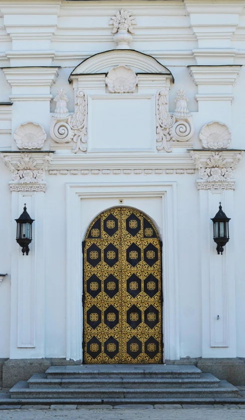 a large white building with a gold door, inspired by Károly Markó the Elder, unsplash, baroque, sconces, paisley, decorations, intricate details photograph