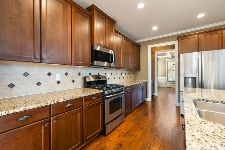 a kitchen with wooden cabinets and stainless steel appliances, by Carey Morris, unsplash, avatar image, wide high angle view, high resolution product photo, upscaled to high resolution