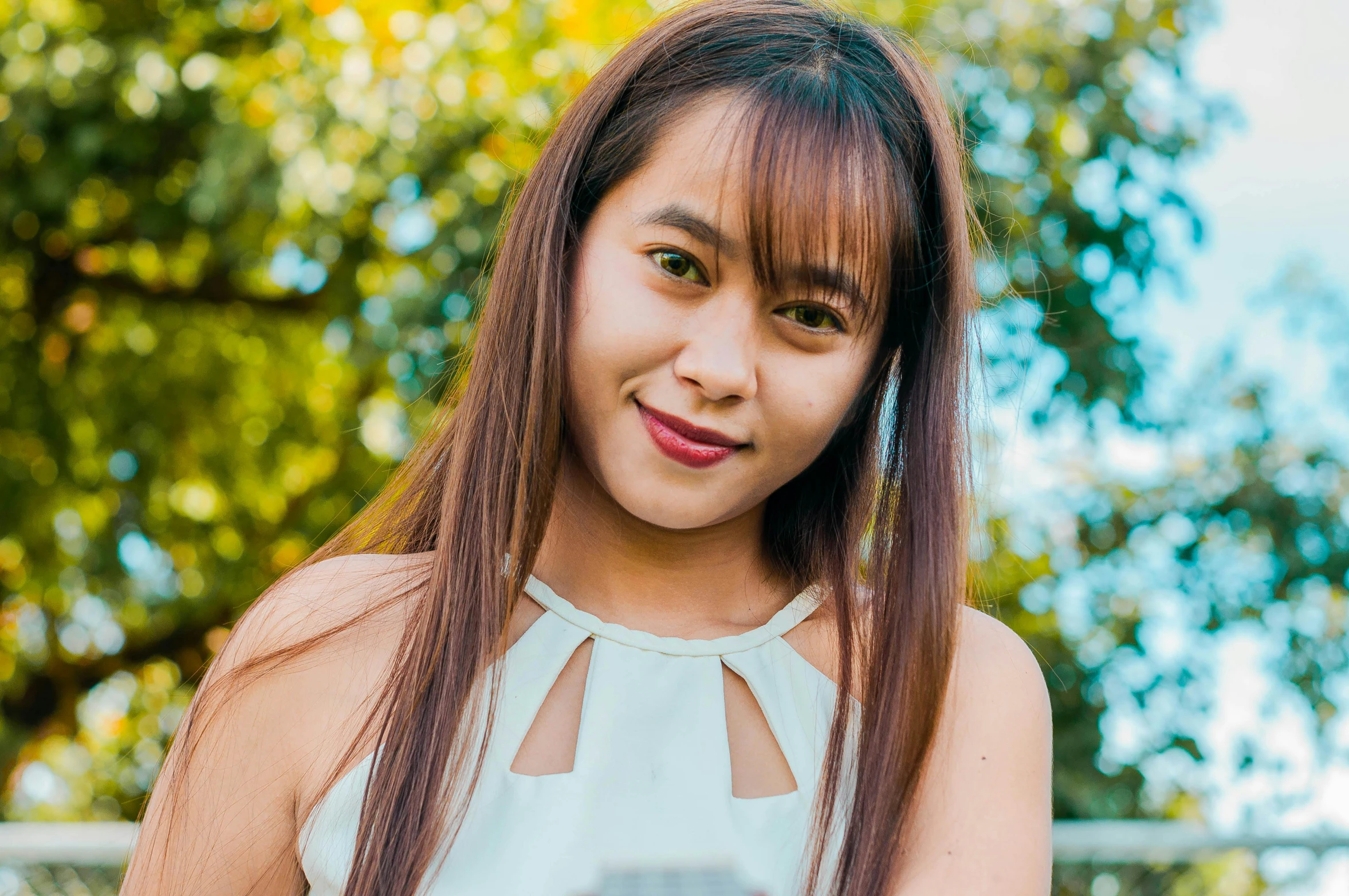 a close up of a person holding a cell phone, smiling for the camera, mai anh tran, straya, avatar image