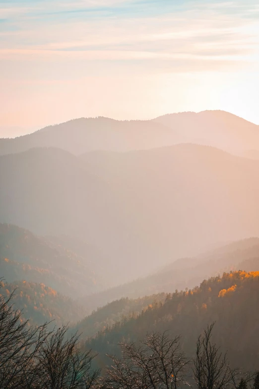 a view of the mountains from the top of a hill, inspired by LeConte Stewart, trending on unsplash, soft autumn sunlight, stacked image, multiple stories, a high angle shot