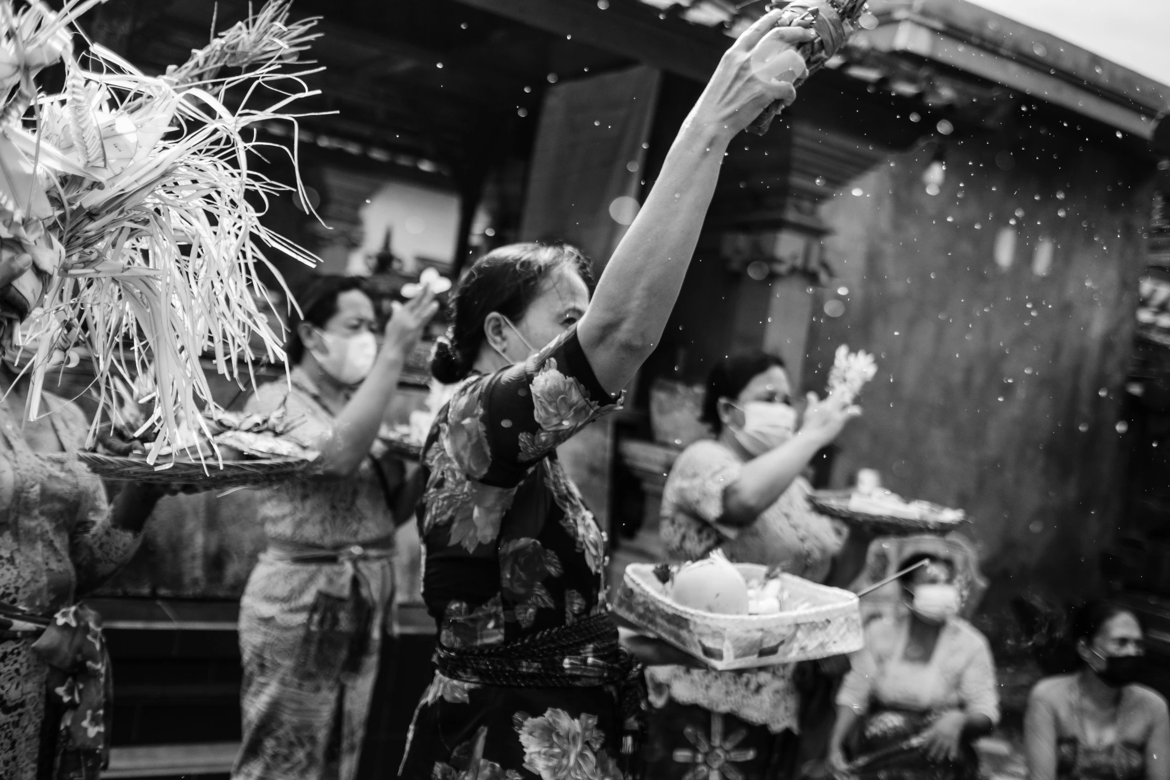 a black and white photo of a group of people, a black and white photo, pexels contest winner, process art, bali, feast, day after raining, asian woman