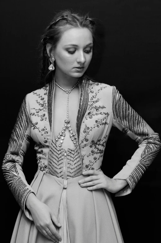 a black and white photo of a woman in a dress, inspired by Maud Naftel, tumblr, arabesque, wearing a fancy jacket, sansa stark, closeup!!!!!!, taken in the 1970s