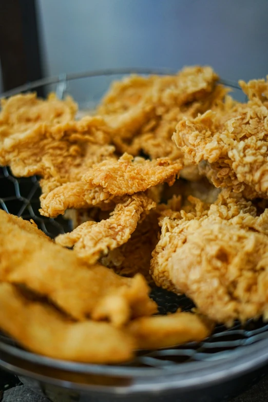 a bowl filled with fried food on top of a table, pikes, up close image, hybrids, thumbnail