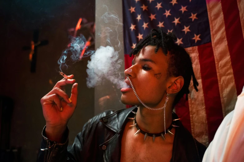 a man smoking a cigarette in front of an american flag, inspired by Nan Goldin, unsplash, transgressive art, wearing chains, playboi carti, at a rave, ashteroth