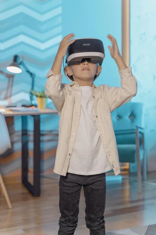 a little boy wearing a virtual reality headset, a hologram, pexels, interactive art, wearing a navy blue utility cap, avatar image, full-body, vp of marketing