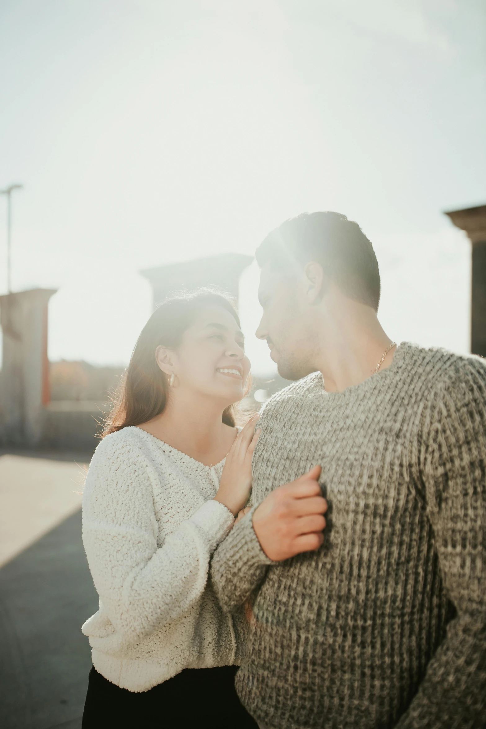 a man and woman standing next to each other, pexels contest winner, happening, afternoon sunshine, flirty, grey, instagram post