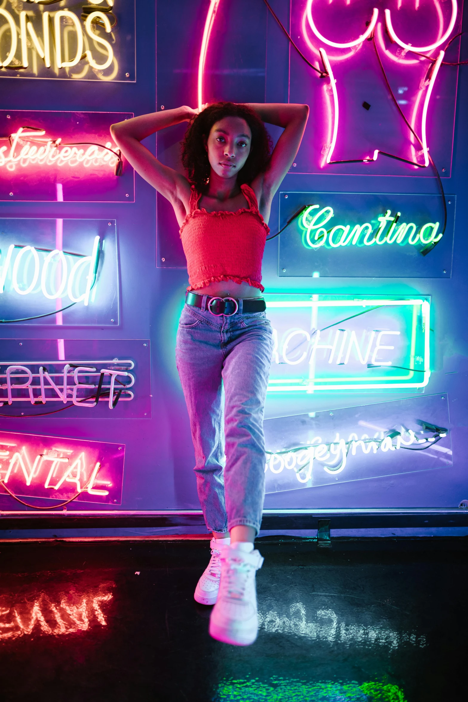 a woman standing in front of neon signs, trending on pexels, madison beer, ((neon colors)), dilraba dilmurat, tinyest midriff ever