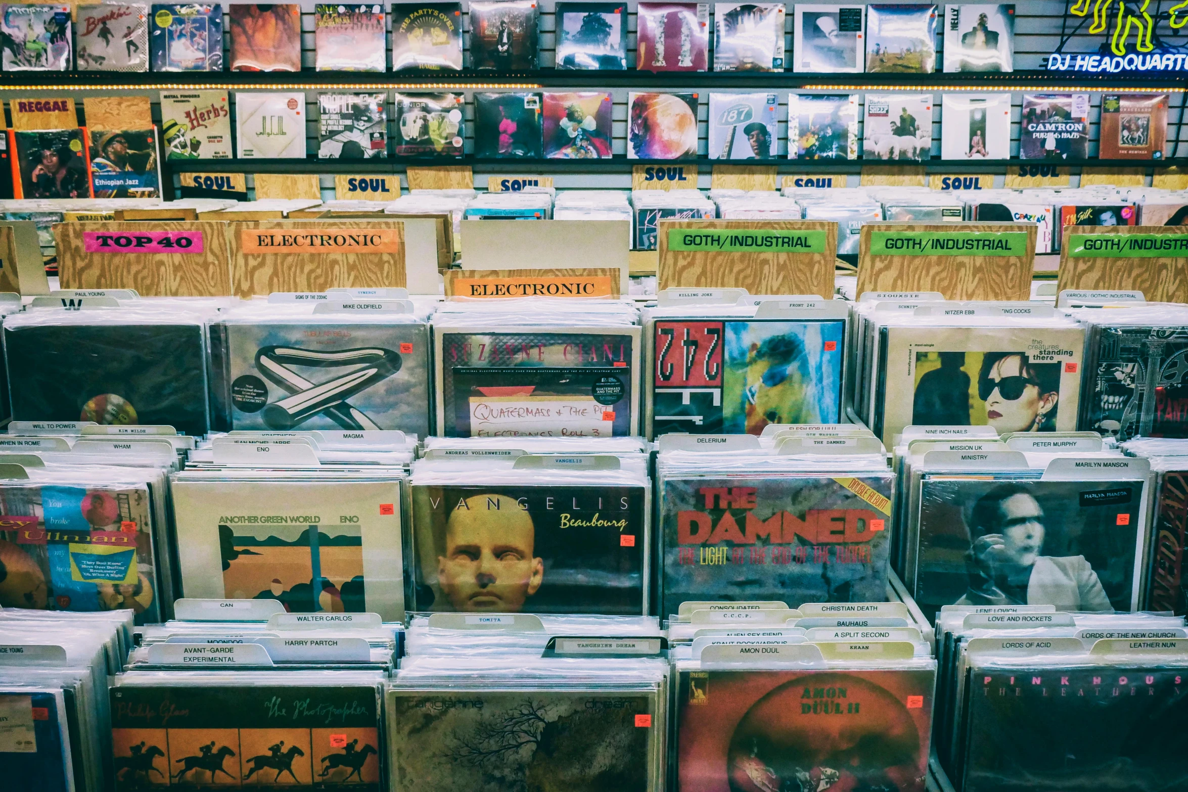 a bunch of cds stacked on top of each other, an album cover, unsplash, maximalism, shelves filled with tomes, quirky shops, thumbnail, turntables
