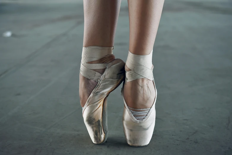 a close up of a pair of ballet shoes, pexels contest winner, arabesque, square, standing, damaged, natasha tan maciej kuciara