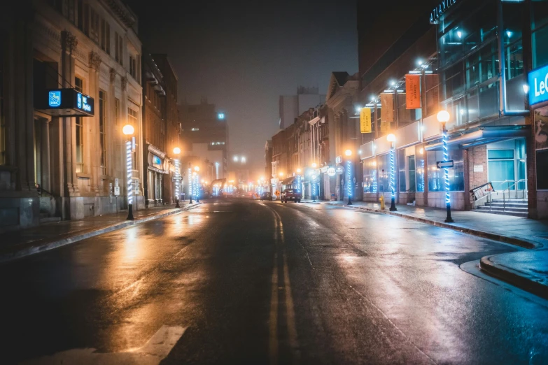 a city street lined with tall buildings at night, by Greg Rutkowski, pexels contest winner, chesterfield, hazy and dreary, market street, empty streets