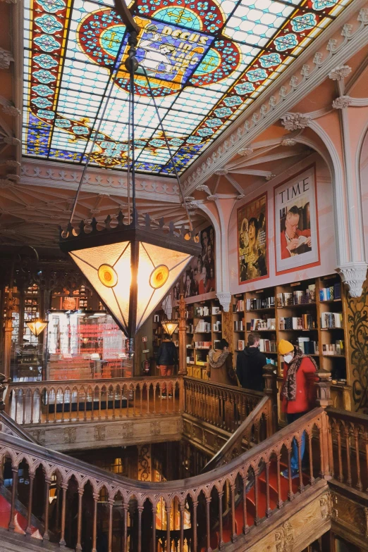 the inside of a building with a stained glass ceiling, art nouveau, liminal bookshop, tourist, pink, thumbnail