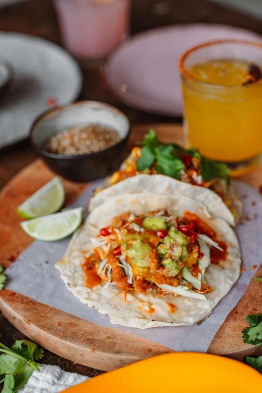 a couple of tacos sitting on top of a wooden cutting board, by Lee Loughridge, drinks, daily specials, profile image, malaysian