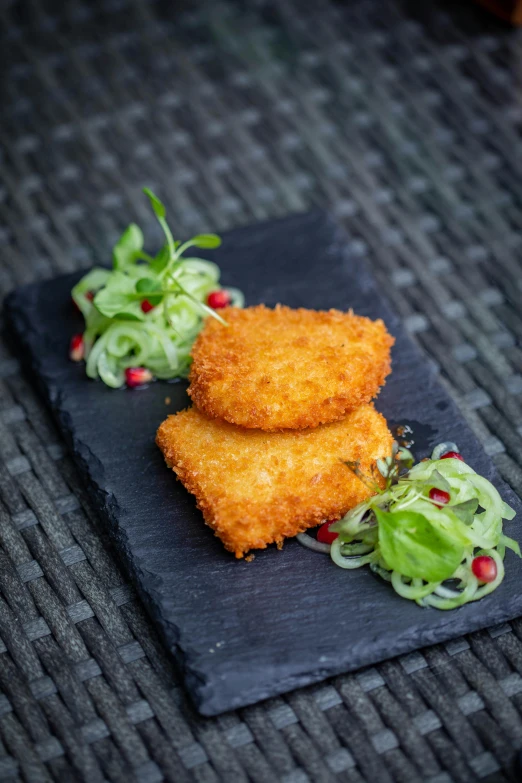 a close up of a plate of food on a table, very crispy, green square, tail fin, aleksandra waliszewska